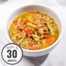 A bowl of curried lentil soup with coconut milk on a white surface with time stamp at the bottom left corner | Hurry The Food Up