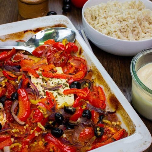 A tray full of roasted veggies and melted feta with rice | Hurry The Food Up