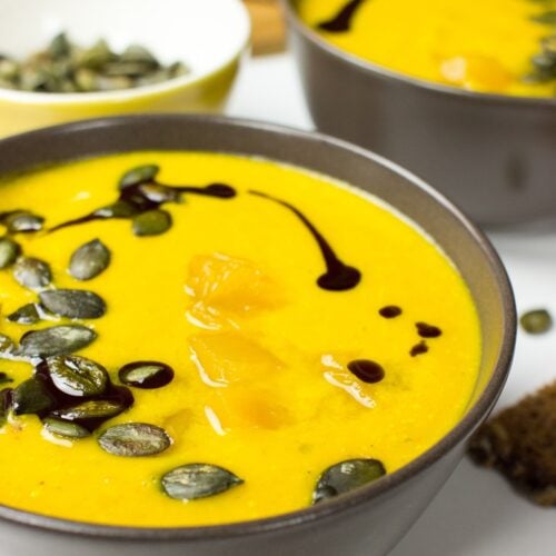 Pumpkin and Carrot Soup topped with pumpkin seeds | Hurry The Food Up